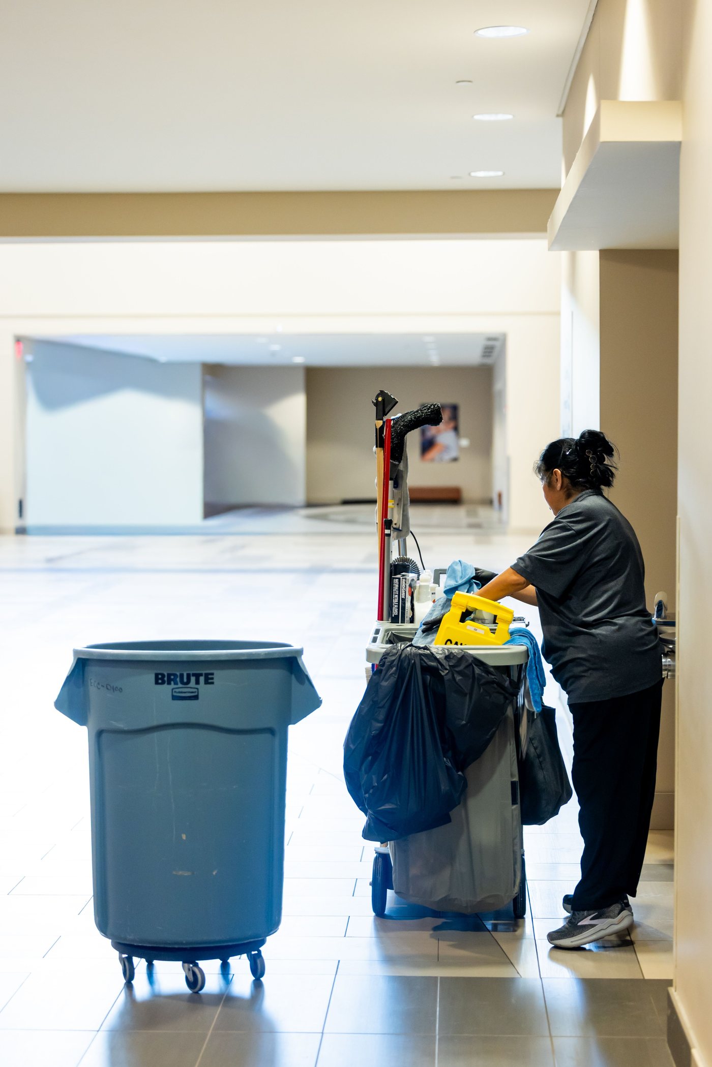 Santa Rosa janitorial crew and cleaning cart in a commercial building